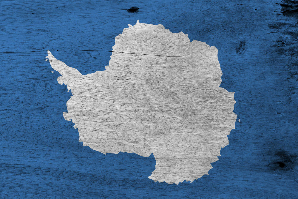 Flag of Antarctica on wooden plate background